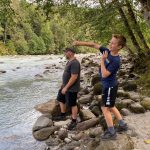 Mountain Loop Highway Stillaguamish River man and boy playing